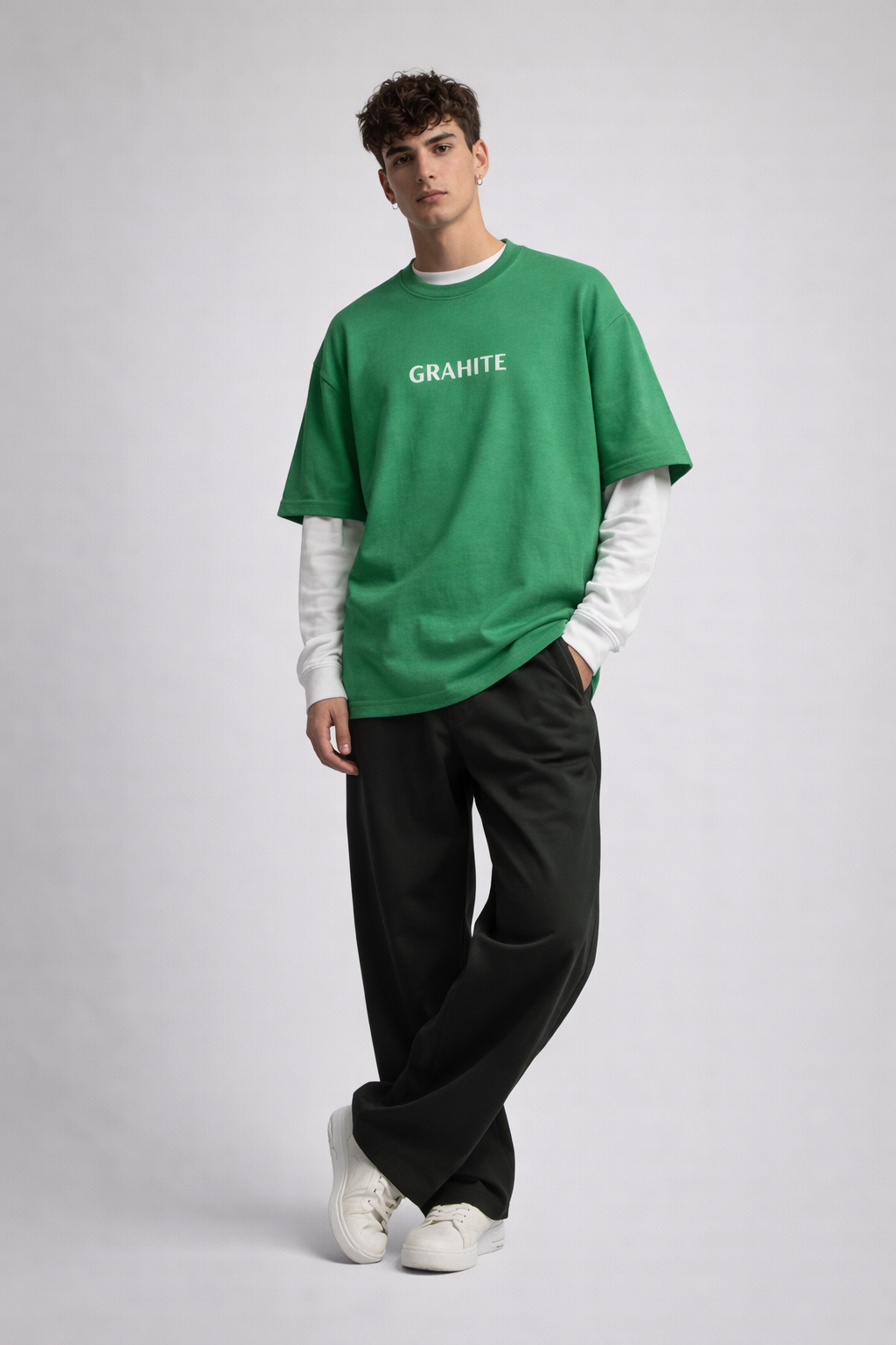Person wearing a green 'GRAHIT' t-shirt on a gray background